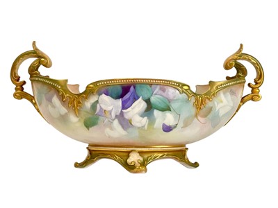 Lot 384 - A Royal Worcester porcelain twin handled centre bowl.