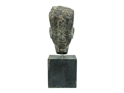 Lot An Egyptian granite head of a pharaoh.