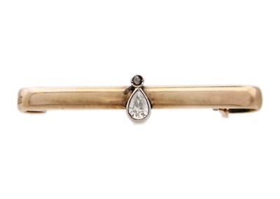 Lot 267 - A 9k rose gold bar diamond set brooch.