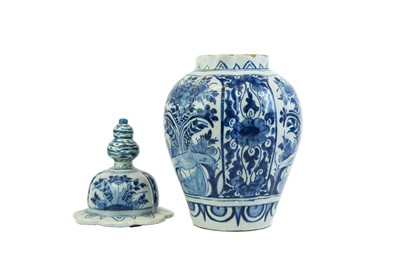 Lot 1133 - A Dutch Delft blue and white baluster vase and cover.