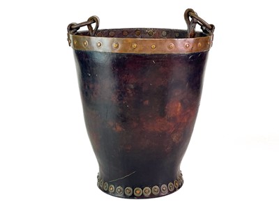 Lot 23 - A leather and copper bound riveted fire bucket.