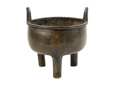 Lot 1064 - A Chinese bronze ding tripod censer.