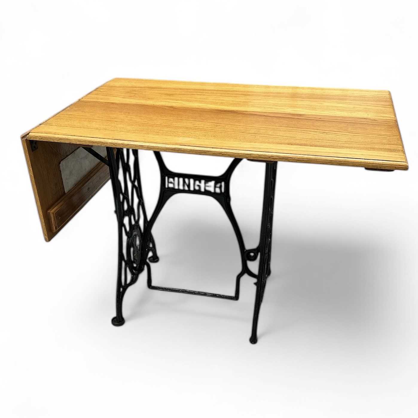 Lot 206 - A drop-leaf Singer work table, 135cm wide,