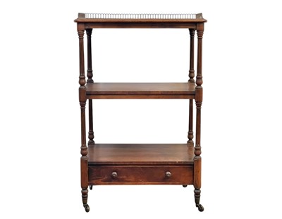 Lot 676 - A Victorian three tier walnut dumb waiter by Holland & Sons.