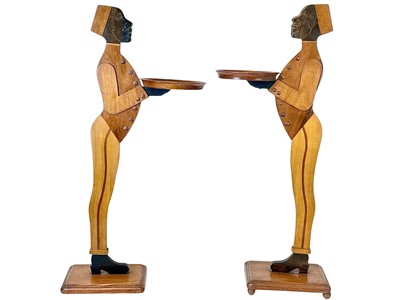 Lot 12 - A pair of mahogany figural dumb waiters.