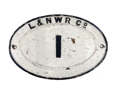 Lot 181 - An oval cast iron L&NWR railway bridge plate.