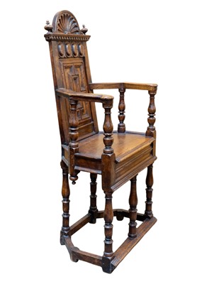 Lot 1003 - A matched pair of French Renaissance walnut caquetoire chairs.