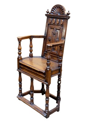 Lot 1003 - A matched pair of French Renaissance walnut caquetoire chairs.