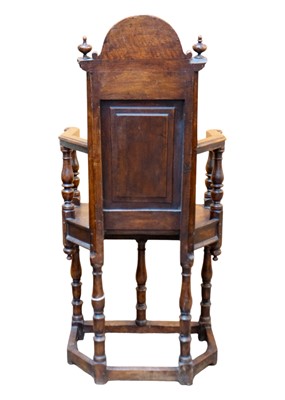 Lot 1003 - A matched pair of French Renaissance walnut caquetoire chairs.