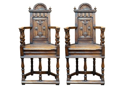 Lot 1003 - A matched pair of French Renaissance walnut caquetoire chairs.