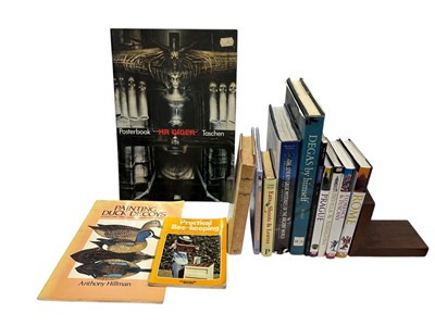 Lot 79 - A HR Giger posterbook by Taschen, containing...