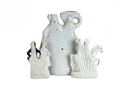 Lot 486 - A Victorian Staffordshire pottery flat back figure group of a harvest couple.