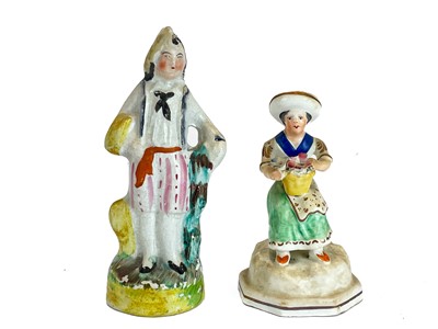 Lot 486 - A Victorian Staffordshire pottery flat back figure group of a harvest couple.