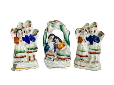 Lot 486 - A Victorian Staffordshire pottery flat back figure group of a harvest couple.