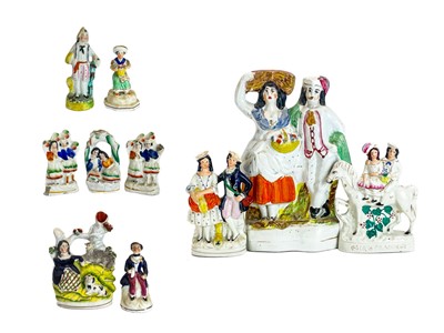 Lot 486 - A Victorian Staffordshire pottery flat back figure group of a harvest couple.