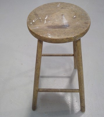 Lot 46 - An Elm Stool. The Stool measures 67cm tall...