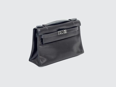 Lot 301 - HERMES - A Kelly Pochette clutch bag with Palladium hardware.