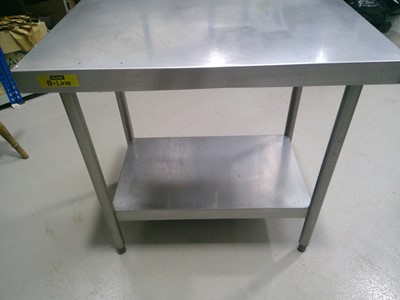 Lot 14 - A Bartlett B-Line Stainless Steel Table. The...