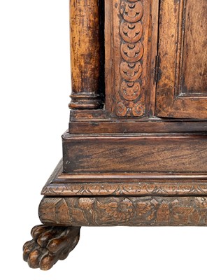 Lot 1096 - An Italian Baroque walnut credenza.