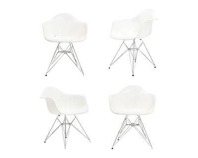 Lot 1196 - After Charles and Ray Eames, four DAR style armchairs.