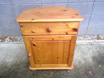 Lot 100 - A Pine Bedside Cabinet. The Cabinet measures...