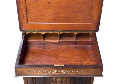 Lot 644 - A Victorian rosewood and inlaid Davenport cabinet.