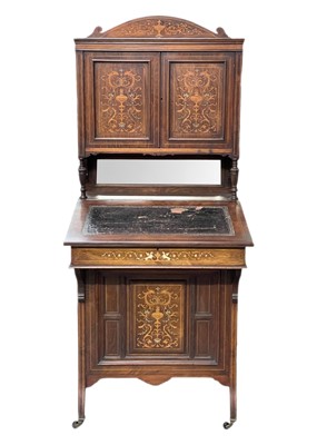 Lot 644 - A Victorian rosewood and inlaid Davenport cabinet.