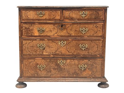 Lot 1158 - A Queen Anne figured walnut, chevron banded and ebony strung chest.