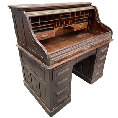 Lot 22 - A handsome oak roll-top desk. With twin...