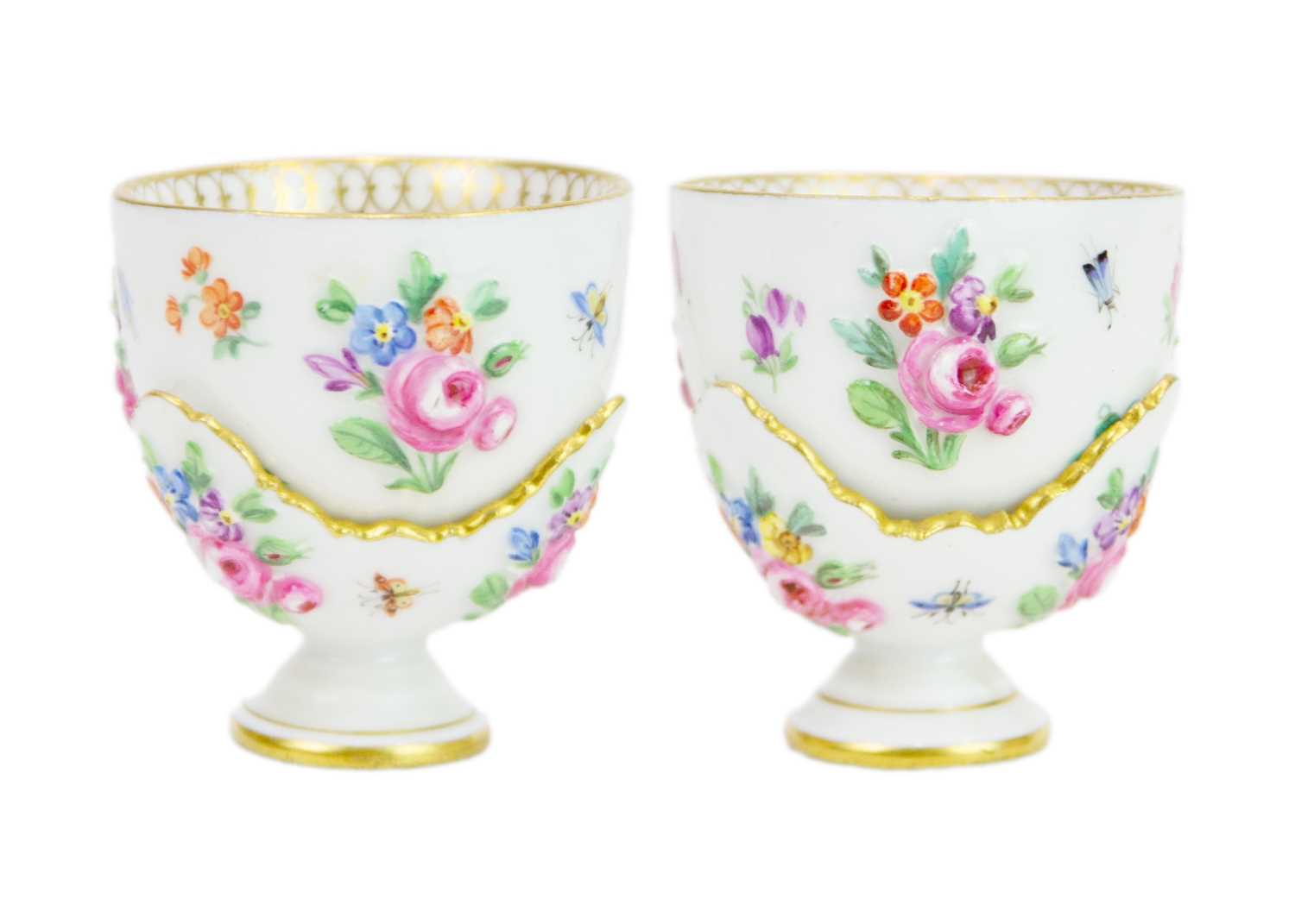 Lot 489 - A rare pair of Meissen sake cups on stands.