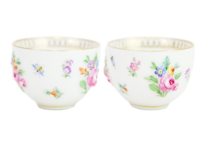 Lot 489 - A rare pair of Meissen sake cups on stands.