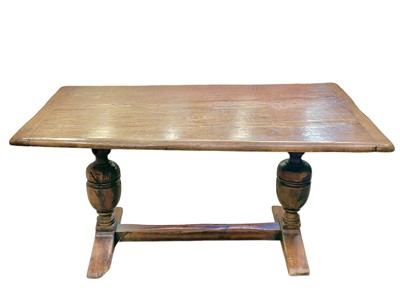 Lot 313 - An oak refectory dining table.