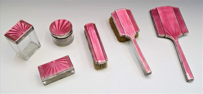 Lot 2041 - A six piece silver and pink enamel dressing...