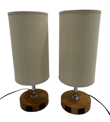 Lot 62 - A pair of bedside table lamps with built-in...