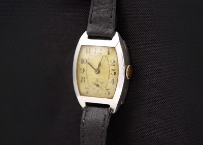 Lot 124 - An Art Deco 1930's silver tonneau cased gentleman's mid-size manual wind wristwatch.