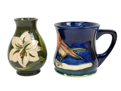 Lot 437 - A Moorcroft Pottery Bermuda Lily pattern vase.