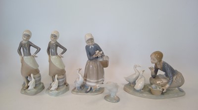 Lot 88 - Four Lladro figures of girls with geese and...