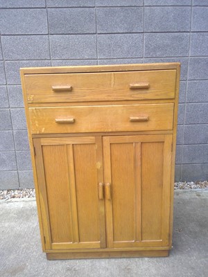 Lot 17 - A 1930s, Golden Oak Tallboy. The piece...