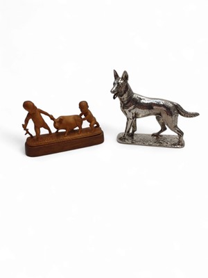 Lot 85 - A Chinese carved boxwood group of two boys and a pig.