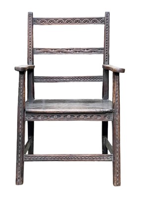 Lot 622 - A carved oak and walnut open armchair.