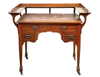 Lot 691 - An Arts and Crafts walnut writing desk.