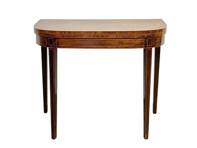 Lot 680 - A Regency rosewood and boxwood strung fold top card table.