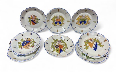 Lot 419 - A set of eight French faience armorial plates.