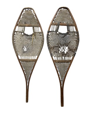 Lot 22 - A pair of Inuit bentwood snow shoes.