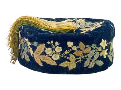 Lot 258 - An embroidered velvet smoking cap.