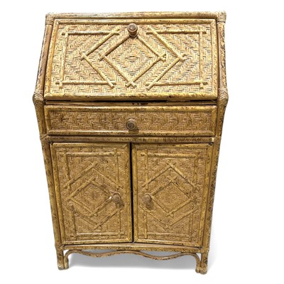 Lot 137 - An unusual cane and rattan bureau, 64cm wide,...