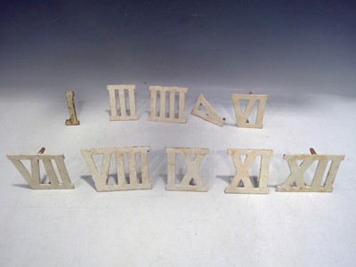 Lot 170 - Ten Metal Roman Numerals marked CGL London,...