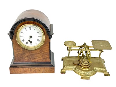 Lot 180 - A walnut cased continental mantel timepiece..