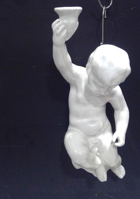 Lot 188 - A Portuguese, Cherub Candle Holder. The Cherub...