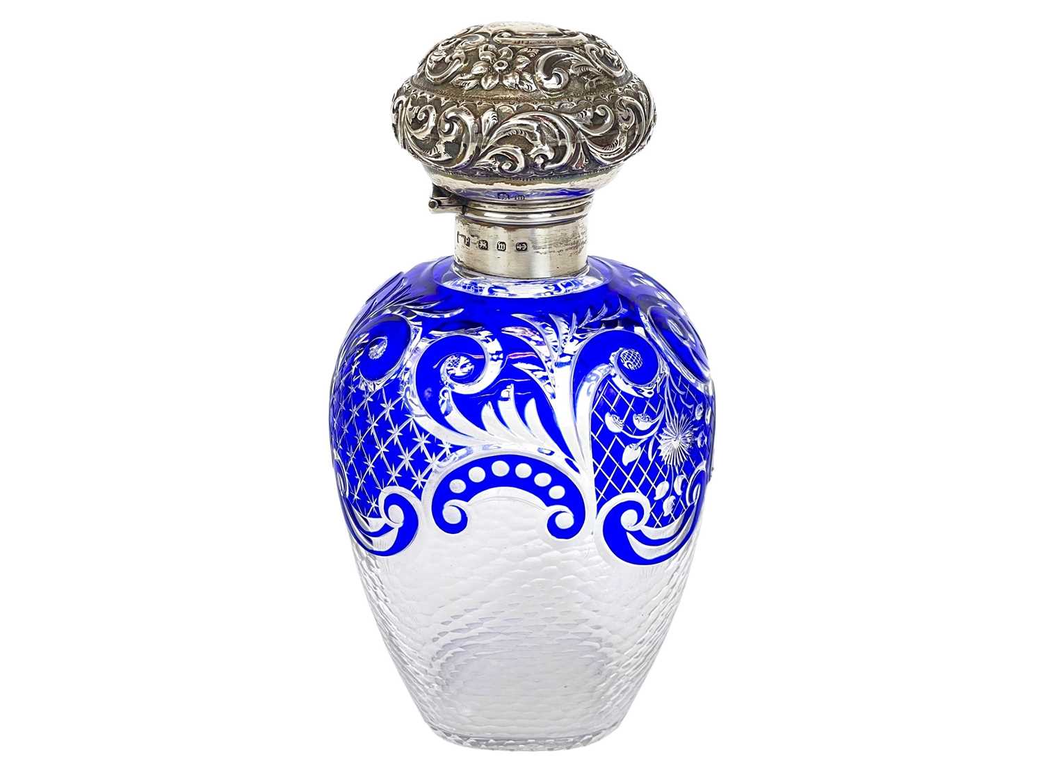 Lot 487 - A Victorian silver mounted blue overlay glass scent bottle.